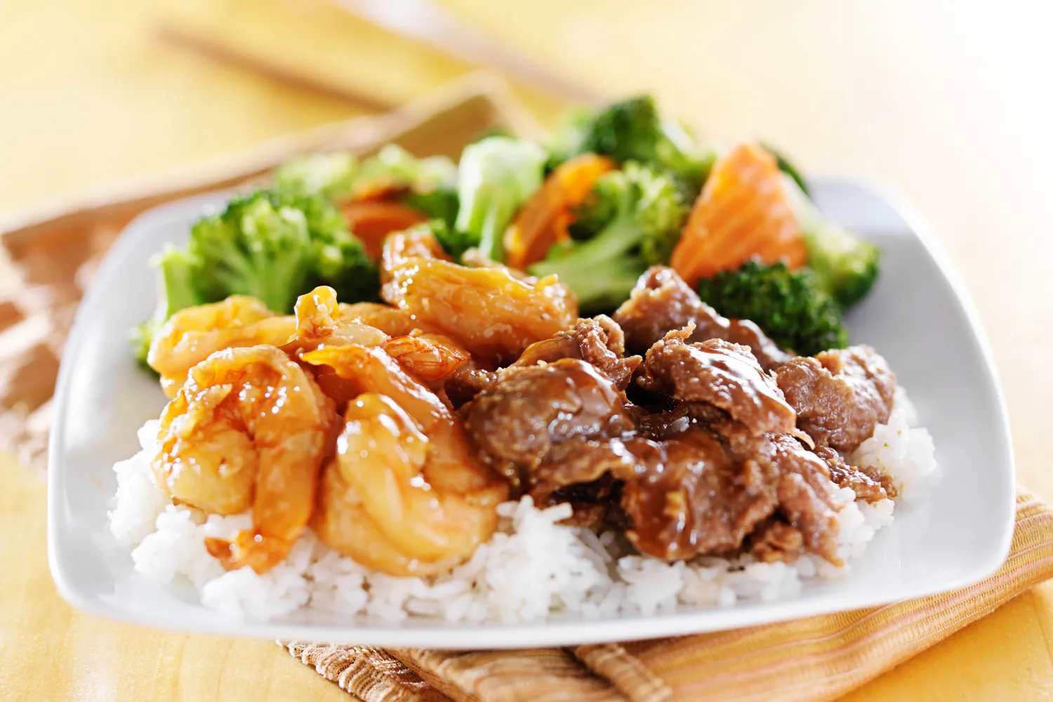 Rice plate with glazed shrimp, beef and mixed fresh vegetables